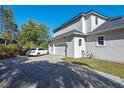 Spacious three-car garage with a long driveway at 1178 Black Walnut Ct, Winter Springs, FL 32708