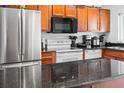 Modern kitchen with stainless steel appliances and granite countertops at 1930 Conway Rd # 2, Orlando, FL 32812