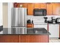 Modern kitchen with stainless steel appliances and granite countertops at 1930 Conway Rd # 2, Orlando, FL 32812