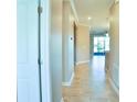 Bright and spacious entryway with tile flooring and neutral wall colors at 2825 Attwater Loop, Winter Haven, FL 33884