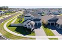 Two-story house situated in a residential neighborhood with a view of surrounding homes at 4381 Davos Dr, Clermont, FL 34711