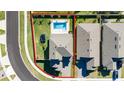 Overhead view of a house with a pool and backyard, surrounded by other homes at 4381 Davos Dr, Clermont, FL 34711