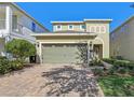 Two-story house with a two-car garage and landscaping at 471 Lasso Dr, Kissimmee, FL 34747