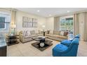 Spacious living room with comfortable seating and large windows at 471 Lasso Dr, Kissimmee, FL 34747