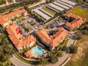 Aerial view showing building location, pool, and parking at 903 Charo Pkwy # 836, Davenport, FL 33897