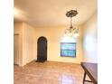 Elegant dining room with arched window and tiled floors at 1720 Crocker Ave, Orlando, FL 32806