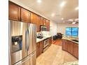 Modern kitchen with stainless steel appliances and hardwood floors at 1720 Crocker Ave, Orlando, FL 32806