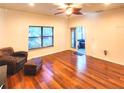 Spacious living room featuring hardwood floors and sliding doors to patio at 1720 Crocker Ave, Orlando, FL 32806