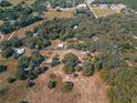 Aerial view of a large rectangular lot with surrounding trees and houses at 17144 Phil C Peters Rd, Winter Garden, FL 34787