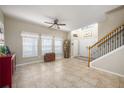 Bright and spacious entryway with tile flooring and staircase at 2338 Darlin Cir, Orlando, FL 32820