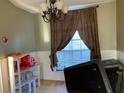 Bright dining room with large window and chandelier at 3481 Cornell Ter, Deltona, FL 32738