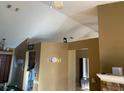 Open living room with vaulted ceilings and a fireplace at 3481 Cornell Ter, Deltona, FL 32738