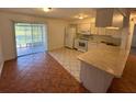 Eat-in kitchen with light cabinets and tile floors at 4518 Watch Hill Rd, Orlando, FL 32808