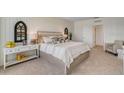 Bright main bedroom featuring a large bed and access to the bathroom at 1778 Three Bars Rd, Kissimmee, FL 34744