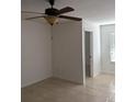 Simple bedroom with ceiling fan and tiled floor at 4524 Commander Dr # 1618, Orlando, FL 32822