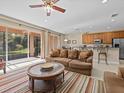 Bright living room with sliding glass doors leading to a patio or backyard at 8336 Riverdale Ln, Davenport, FL 33896