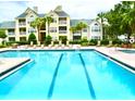 Refreshing community pool with apartment building view at 1023 S Hiawassee Rd # 4022, Orlando, FL 32835