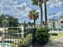View of tennis court and surrounding landscape at 1023 S Hiawassee Rd # 4022, Orlando, FL 32835