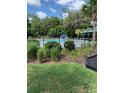 Resort-style pool with lush landscaping and surrounding seating at 1803 Osprey Perch Rd, Davenport, FL 33837