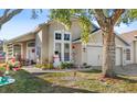 House exterior with festive decorations and a large tree at 230 Bay Meadow Dr, Kissimmee, FL 34746