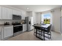 Modern kitchen featuring stainless steel appliances and granite countertops at 3337 Private Oak Dr, Apopka, FL 32703