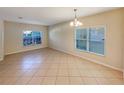 Bright dining room with tile floors and a window providing natural light at 4718 Rockvale Dr, Kissimmee, FL 34758