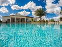 Resort-style pool with clubhouse in the background at 8953 Shine Dr, Kissimmee, FL 34747