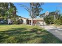 Home exterior featuring a large yard and basketball court at 1621 Puritan,, Winter Park, FL 32792