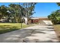 House exterior with basketball hoop and driveway at 1621 Puritan,, Winter Park, FL 32792