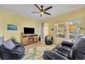 Living room features a fireplace and plenty of natural light at 1812 Arbor Lakes Cir # 1812, Sanford, FL 32771