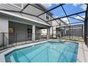 Relaxing pool and spa area with screened enclosure at 4428 Kaipo Rd, Davenport, FL 33897