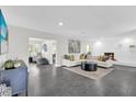 Spacious living room with fireplace and large windows at 8 Pine Ct, Yalaha, FL 34797