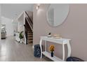 Bright entryway with tiled floors, a large mirror, and a console table at 8940 Play Through Dr, Davenport, FL 33896