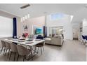 Spacious living room with high ceilings, a large TV, and comfortable seating at 8940 Play Through Dr, Davenport, FL 33896