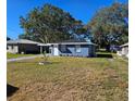 Newly renovated blue house with a landscaped front yard at 1503 33Rd Nw St, Winter Haven, FL 33881