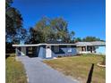 Newly renovated blue house with a landscaped front yard at 1503 33Rd Nw St, Winter Haven, FL 33881