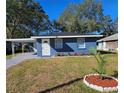 Newly renovated blue house with a landscaped front yard at 1503 33Rd Nw St, Winter Haven, FL 33881