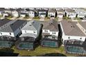 Aerial view showcasing multiple houses with private pools at 16230 Trinidad Way, Clermont, FL 34714
