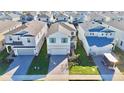 An aerial view of a neighborhood with houses and landscaping at 16230 Trinidad Way, Clermont, FL 34714