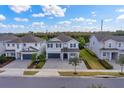 Two-story house in a neighborhood with a paved driveway and landscaped yard at 7457 Marker Ave, Kissimmee, FL 34747