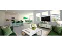 Open living room features a spacious layout with stylish green accents and a modern aesthetic at 2306 Amorie Dr, Kissimmee, FL 34746