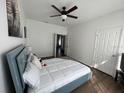 Spacious bedroom with a large bed, plenty of natural light, and a view to another room at 612 Bloomingdale Dr, Davenport, FL 33897