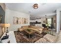 Spacious living area with sectional sofa, coffee table, and open floor plan at 2759 Bookmark Dr, Kissimmee, FL 34746