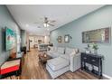 Open concept living room with a view of the kitchen and backyard at 2920 Oak Park Way # Apt A, Orlando, FL 32822