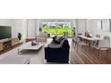 Bright living area showcasing an open floor plan and backyard access at 1623 Green Orchard St, St Cloud, FL 34771