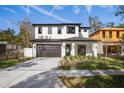 Two-story house featuring a modern facade and driveway at 1627 Illinois St, Orlando, FL 32803