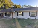 Newly renovated single story home with a brick facade and updated windows at 2011 N Hastings St, Orlando, FL 32808