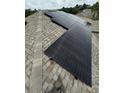 Rooftop solar panels for energy efficiency at 2912 Sunset Lakes Blvd, Kissimmee, FL 34747
