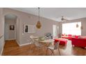 Dining area with hardwood floors and modern light fixture at 3190 Dante Dr # 304, Orlando, FL 32835