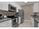Modern kitchen with stainless steel appliances at 3190 Dante Dr # 304, Orlando, FL 32835